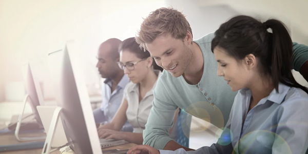 Group of young adults in business training_600x300