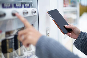 Woman use of soft drink vending system paying by cellphone-1