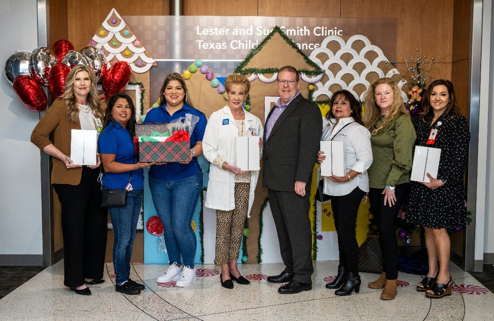 CSI employees pictured with Texas Children’s Hospital team members and their newly donated tablets